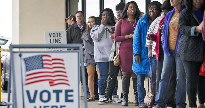 Voters line up outside a polling place on Election Day