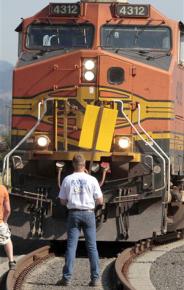 ILWU members block the path of a train outside Longview