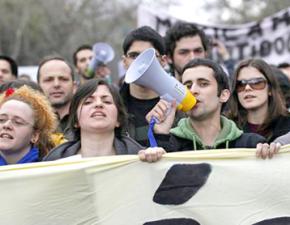 Participants in a mass protest against austerity march in Lisbon on March 12