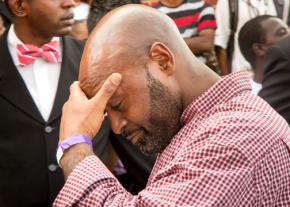 A relative of Mike Brown arrives at the funeral